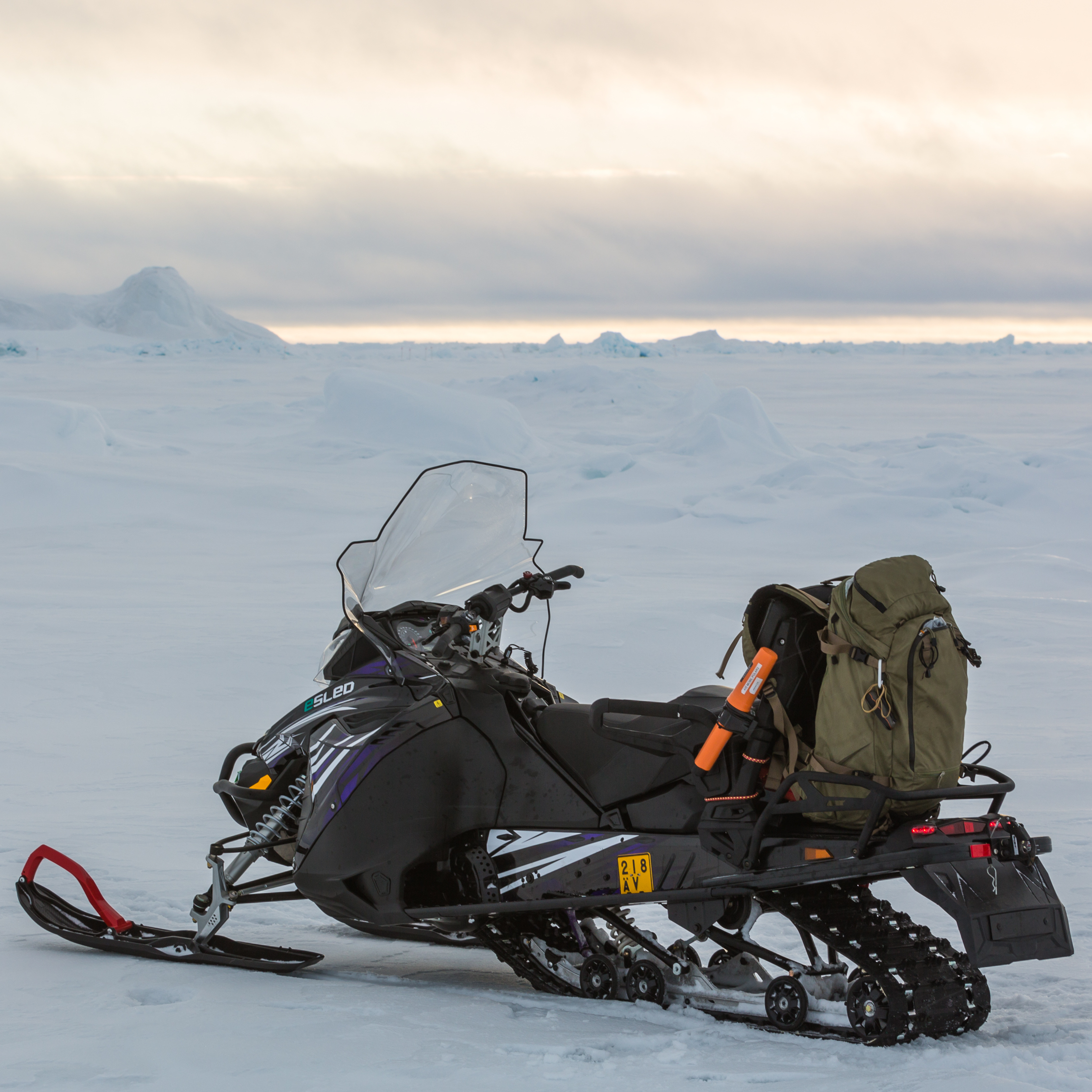 aurora powertrains electric snowmobile in snowfield