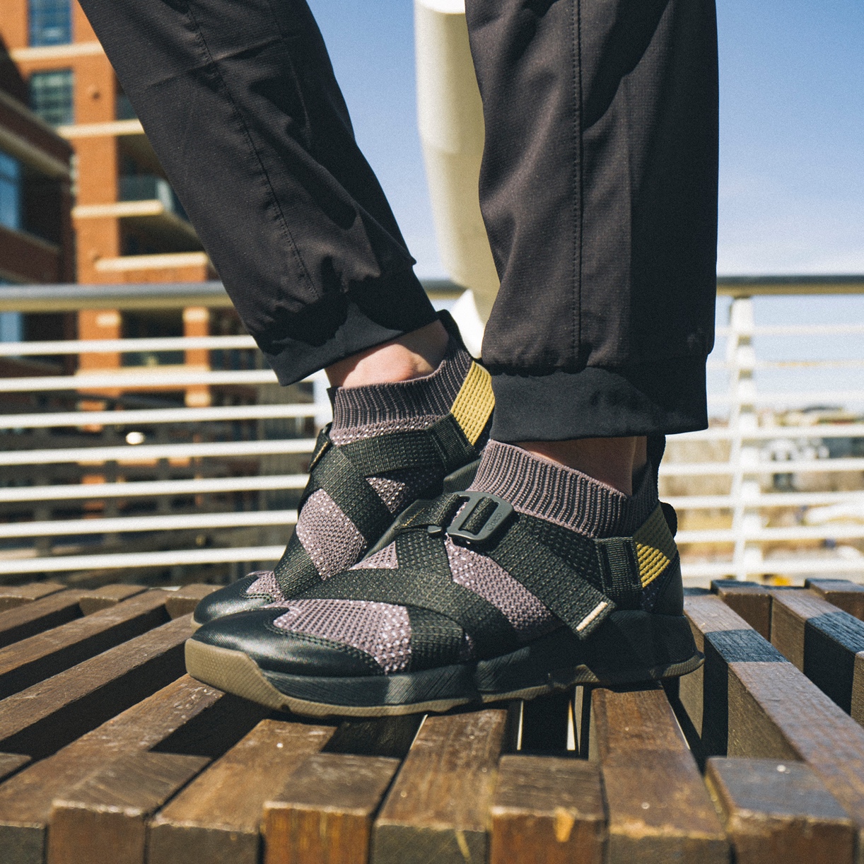 close up of chaco sandals on person's feet