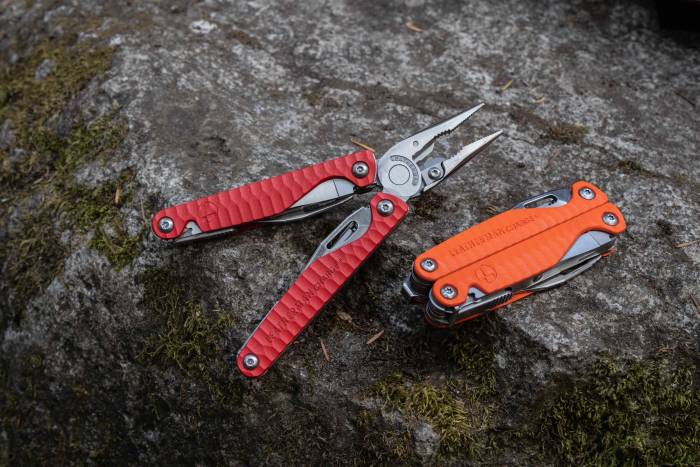 leatherman G10 multi-tool in red and orange, one is open one is closed