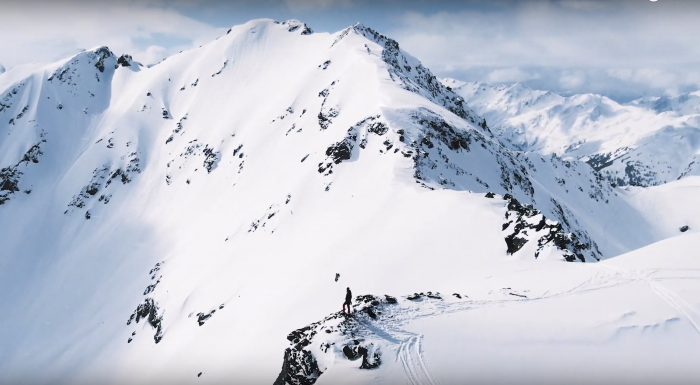 far away view of person on snow covered mountain