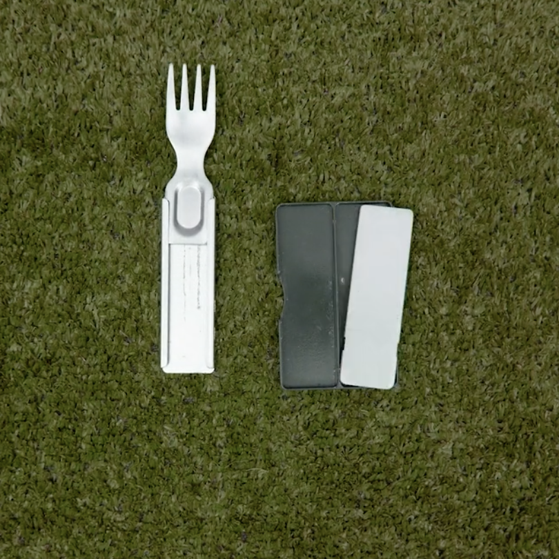 GoSun Flatware folded up on grassy background