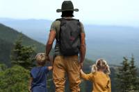 The Best Gifts for Dad: Must-Have Gear for Outdoorsy Men Man Hiking with Kids Father's Day