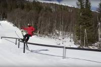 Wait, What? Slopestyle Tricks You Won't Believe Skier Jesper Tjäder leaning back on rail