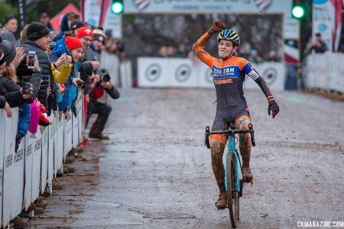 Clara Honsinger pumping her first at finish line at 2018 Cyclocross Nationals