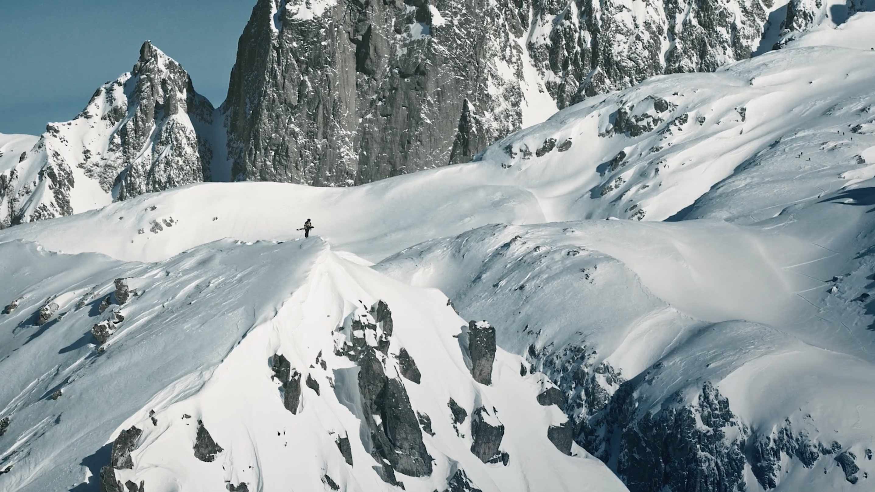 drone footage of skier Sam Favret standing atop peak