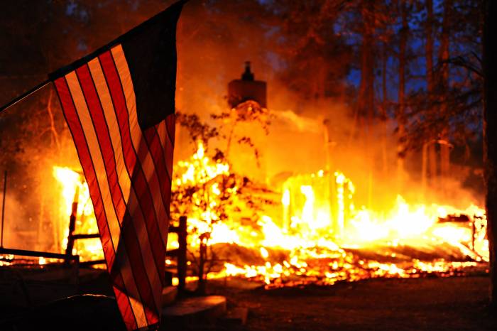 American flag in forest fire