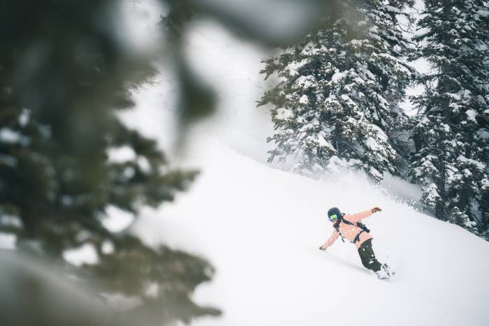 backcountry cyber sale woman snowboarding mountains