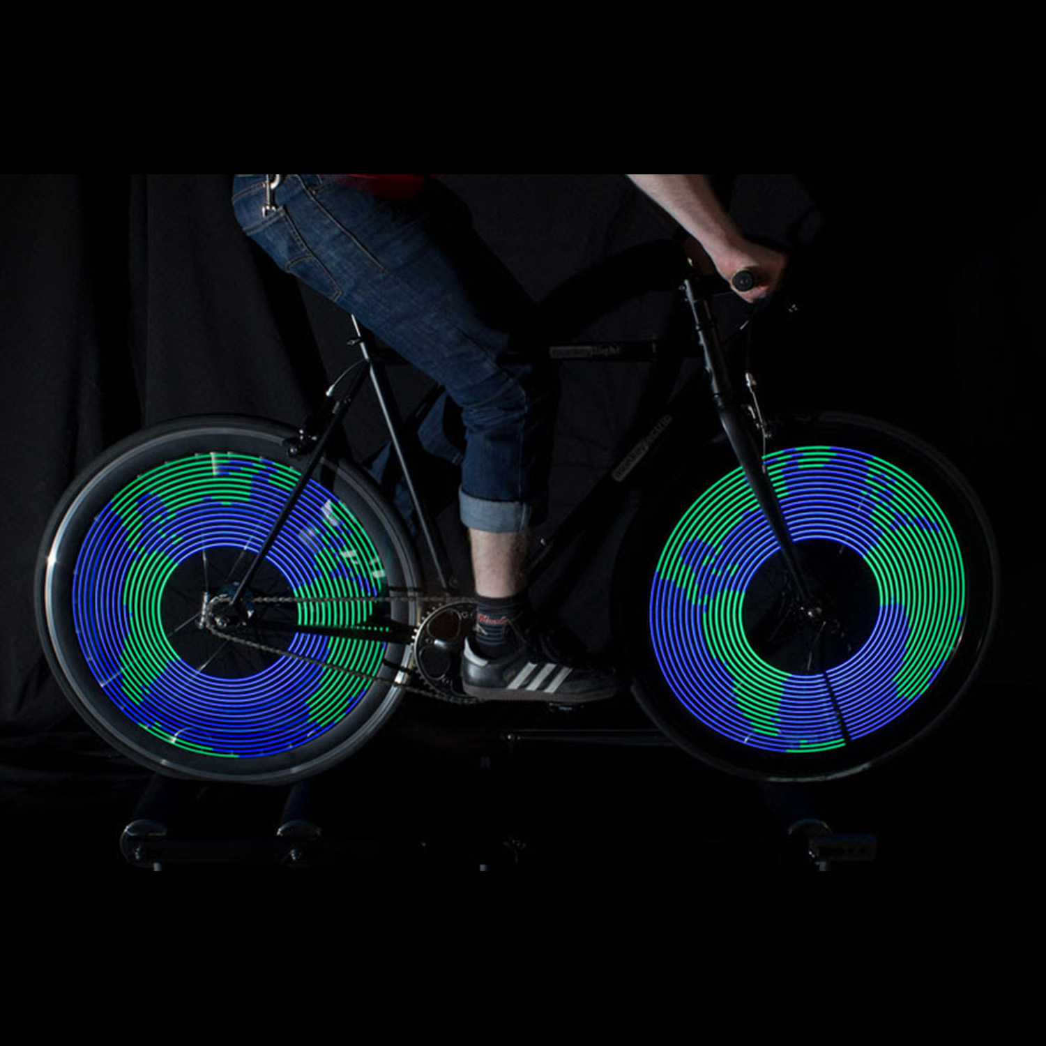 Monkeylectric Earth Lights lit up on bike wheel spokes