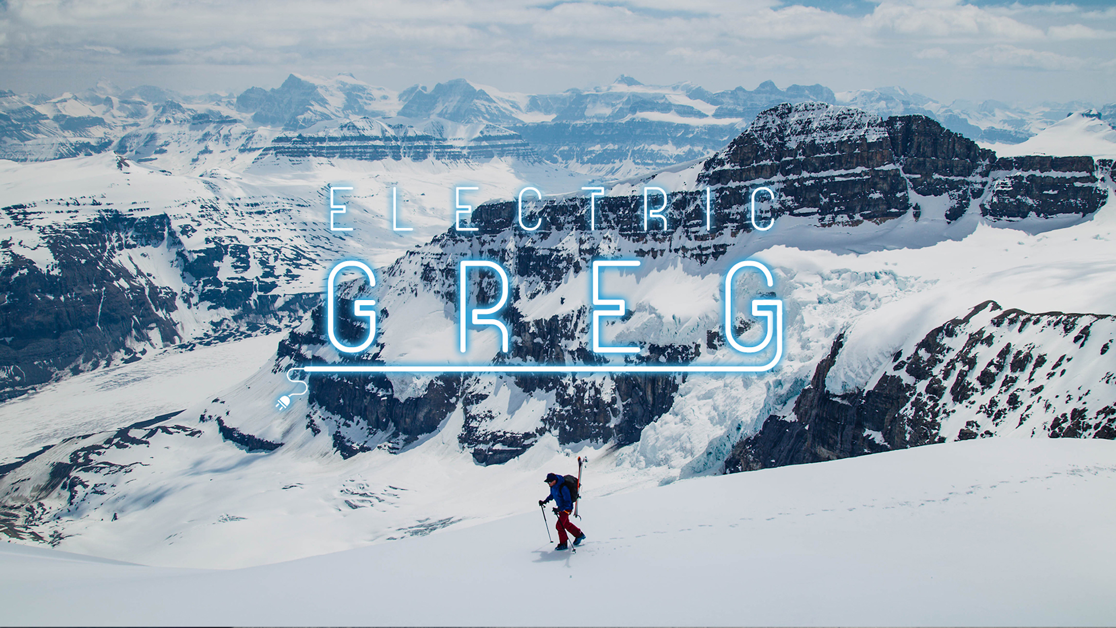 "Electric Greg" in neon lightbulb font over a picture of Greg hill skinning across wide snowy mountain