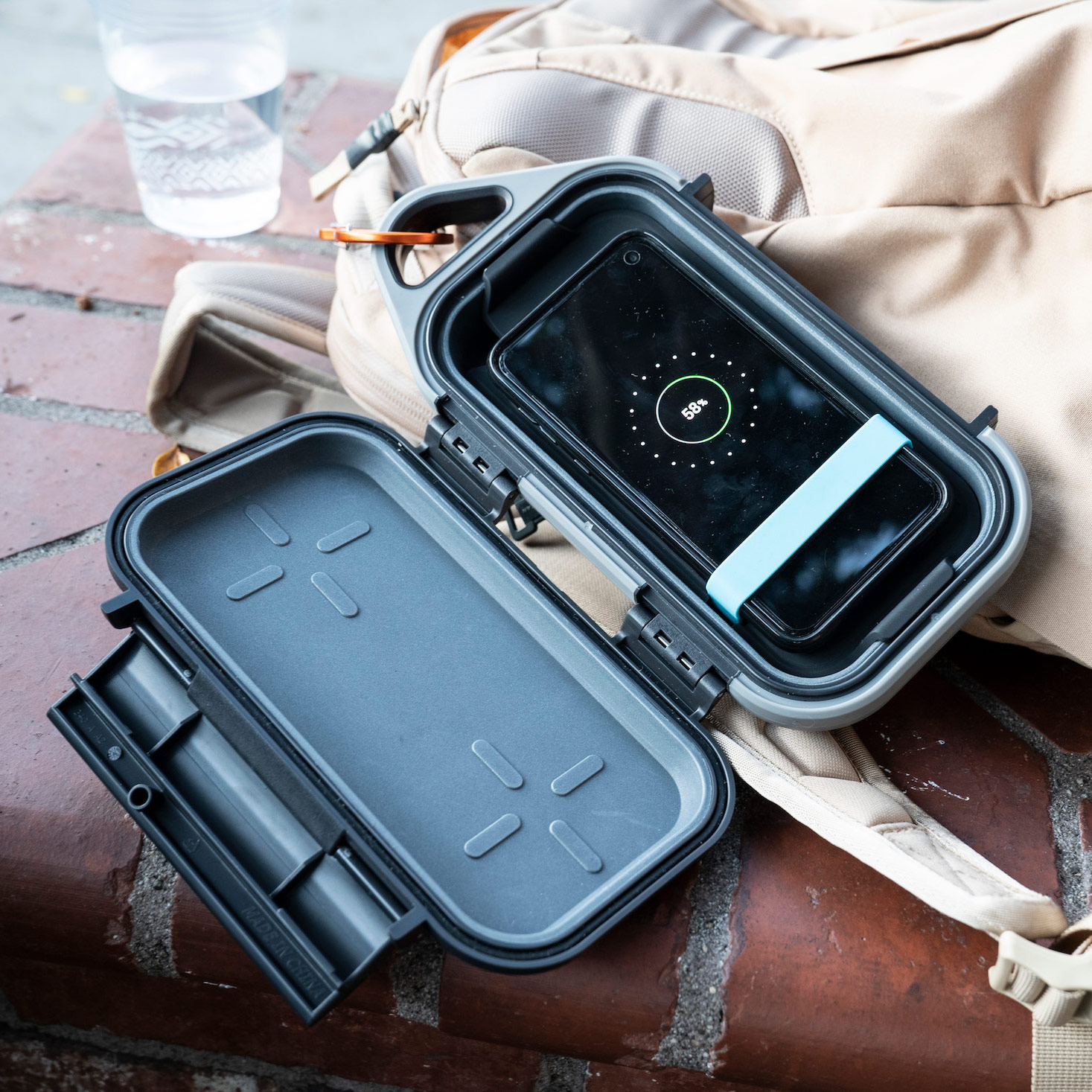 pelican Charge Go Case open with a smartphone inside