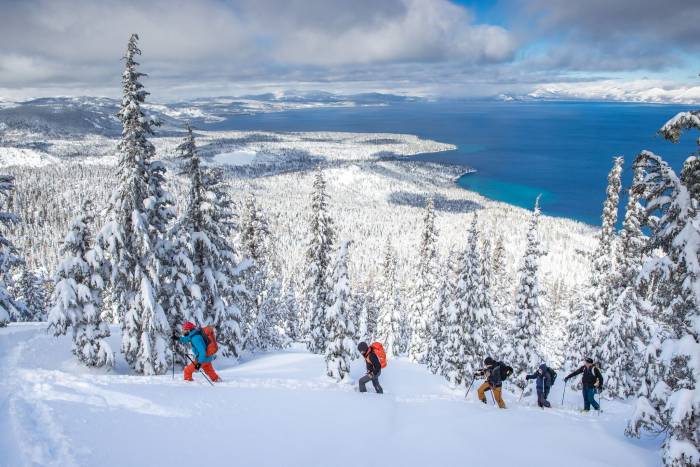 line of skiers moving uphill at Tahoe ski tour event