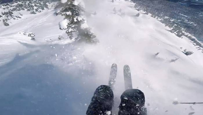 view of skiers legs and feet as they get caught in an avalanche