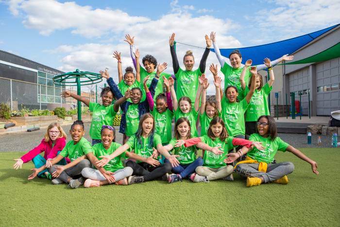 Girls on the Run International Chapter 2019 group photo with 20 girls in green t-shirts