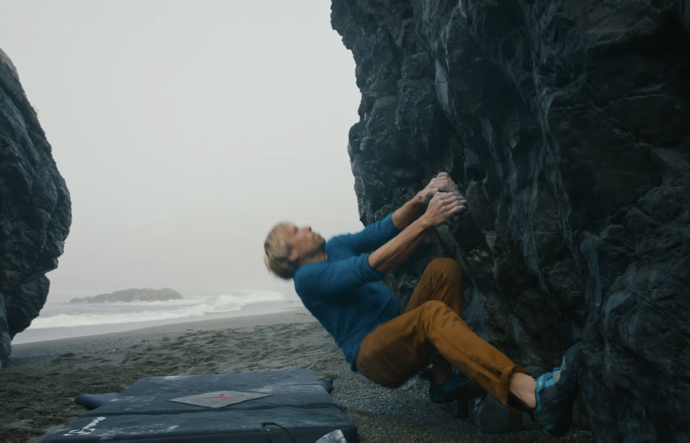 Ben Moon climbing by the ocean