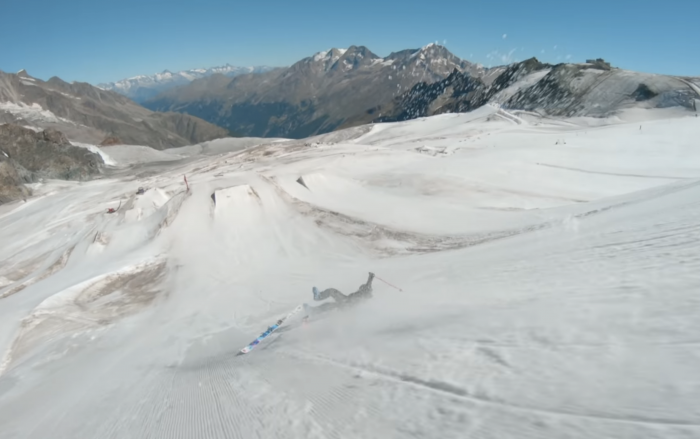 skier ejecting from ski and falling downhill in crash