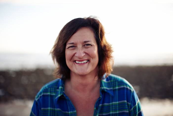 Headshot of Patagonia CEO Rose Marcario in a flannel