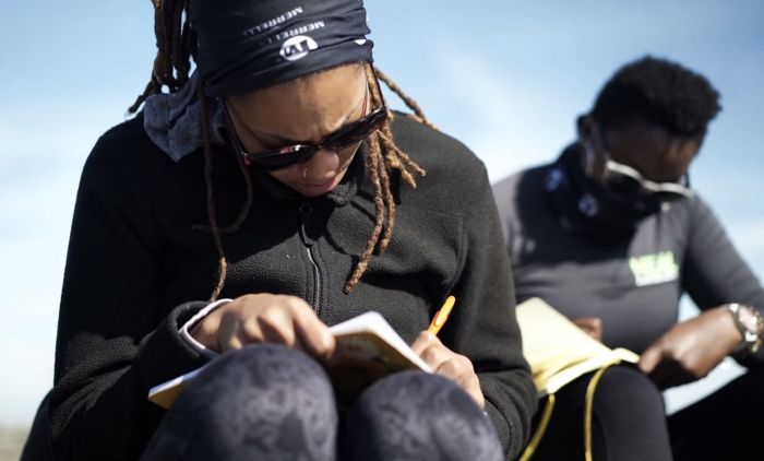 Black women journaling outdoors