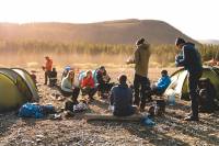 Group of People Camping and Eating