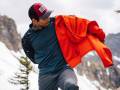 The Bestselling Gear at REI This Week Person Putting on Marmot Layer