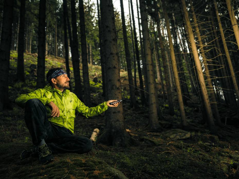 Ultimate Gift Guide: Win the Holidays With Outdoor Gear Person in the woods using Ledlenser P7R Signature Edition Flashlight