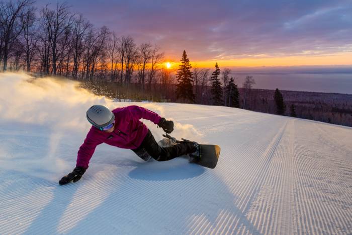 Person Snowboarding at Sunset