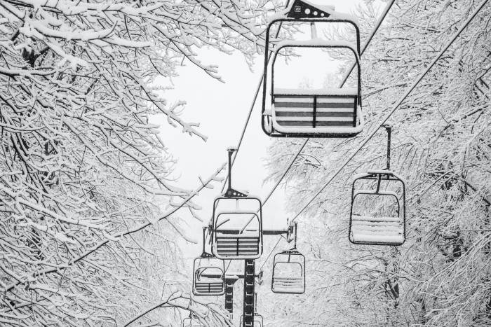 double chairlift covered in snow