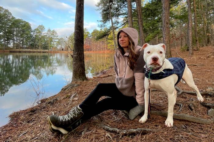 Woman wearing Shelled Retro-X® Fleece Pullover Near Lake with Dog