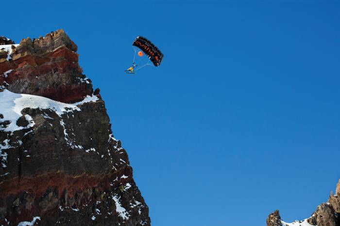 matthias BASE jumping off rocky cliff