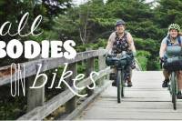 Fat Bikers: 'All Bodies on Bikes' Pushes for a Welcoming Cycling Community two women riding bikes over bridge, title reads "All Bodies on Bikes"