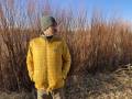 Man standing in gold Patagonia Nano Puff jacket outside