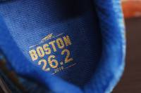 a label on the inside of an Altra Escalante Racer blue Boston Marathon edition shoe