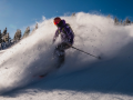 Lahota skier connor ryan skiing downhill through powder at Eldora Mountain