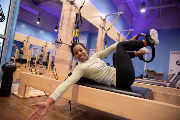 woman demonstrating pilates exercise twist for skiers
