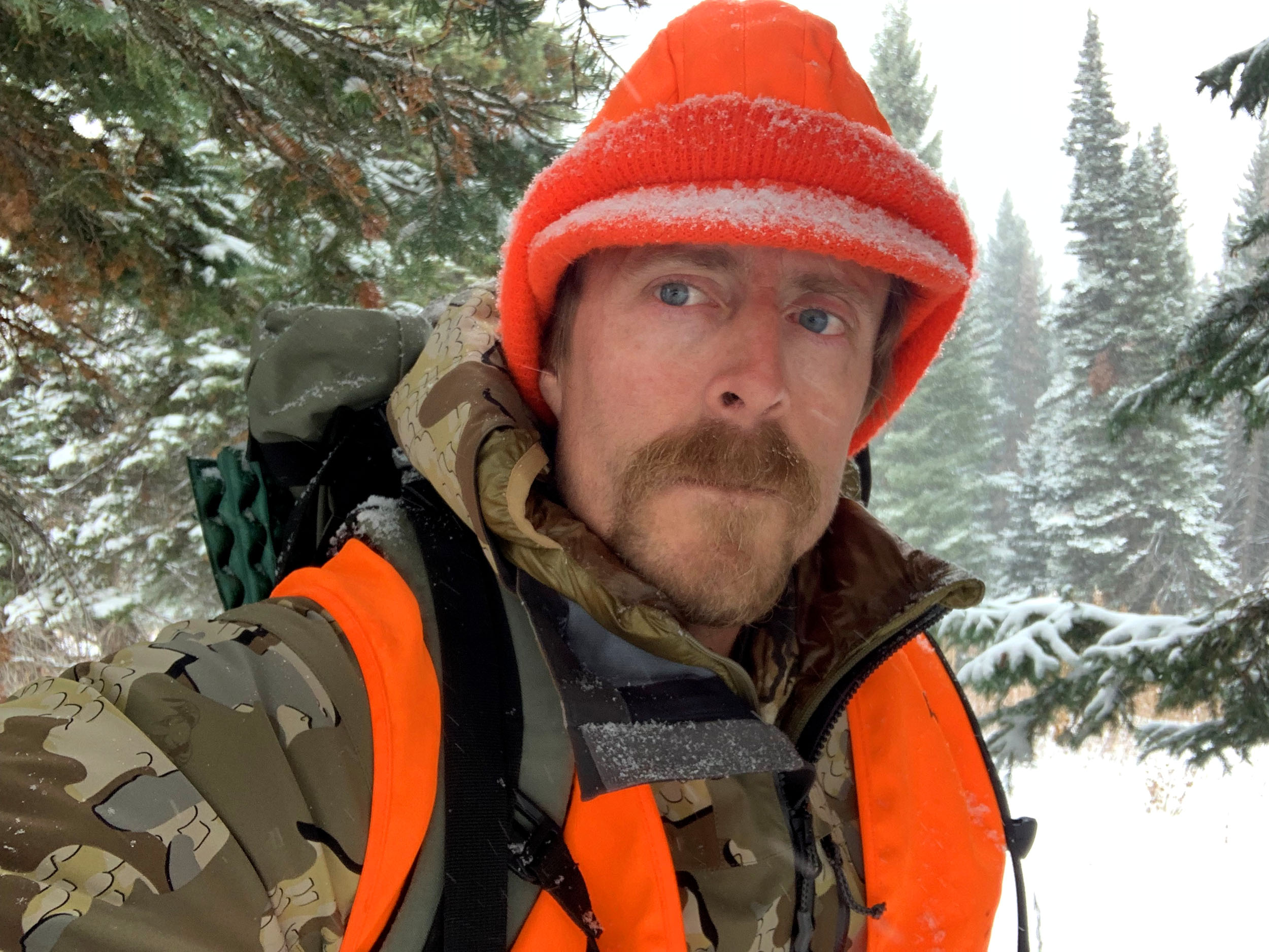 Hunter wearing KUIU Chugach TR Jacket in snow storm