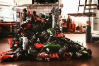 Recycle Your Ski Boots: Tecnica Debuts First-of-Its-Kind Program in Europe metal bin tipped over with Tecnica ski boots spilling out onto the floor
