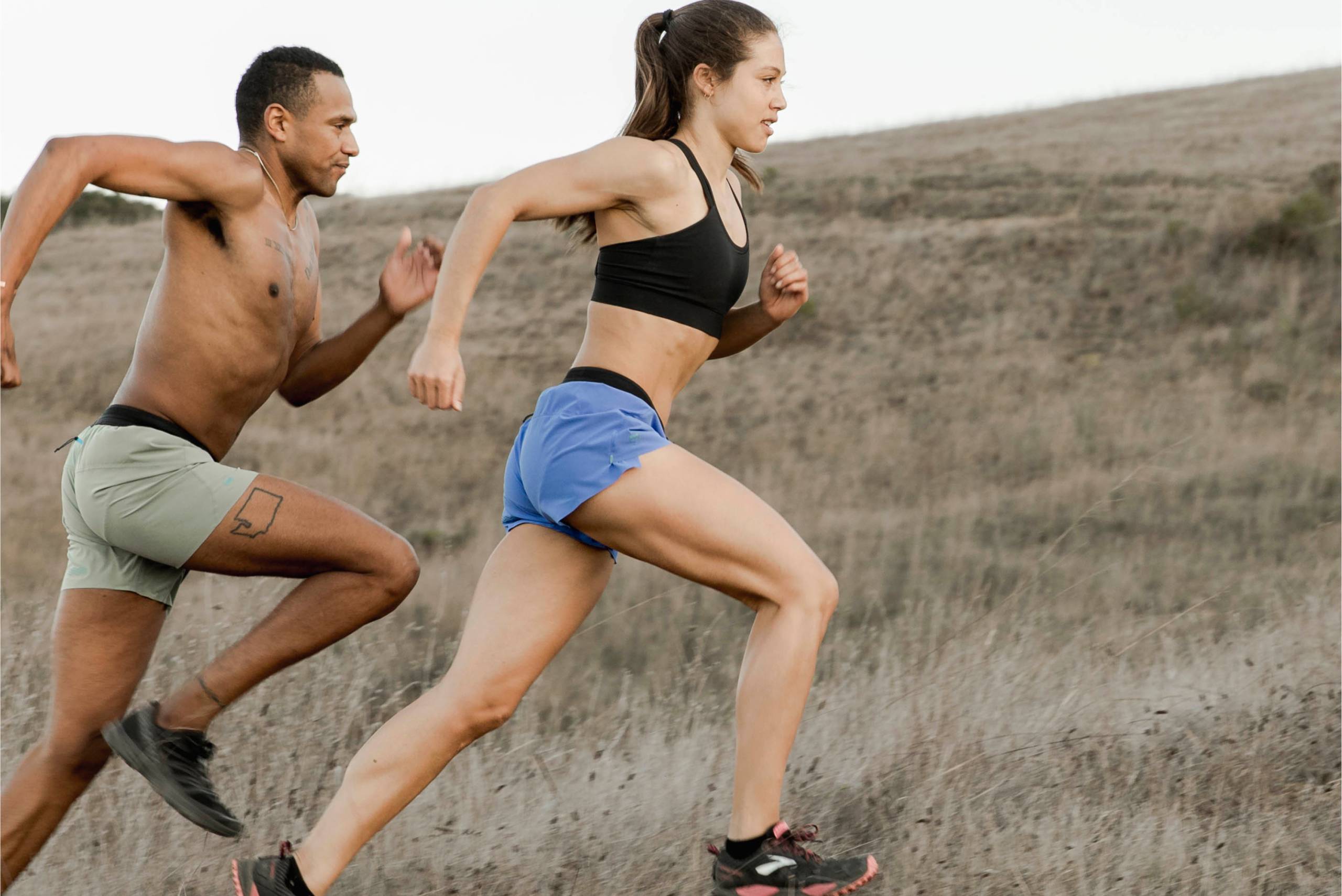 Man and woman runners wearing Janji