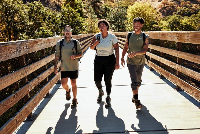 Merrell Moab Collection hkers crossing bridge