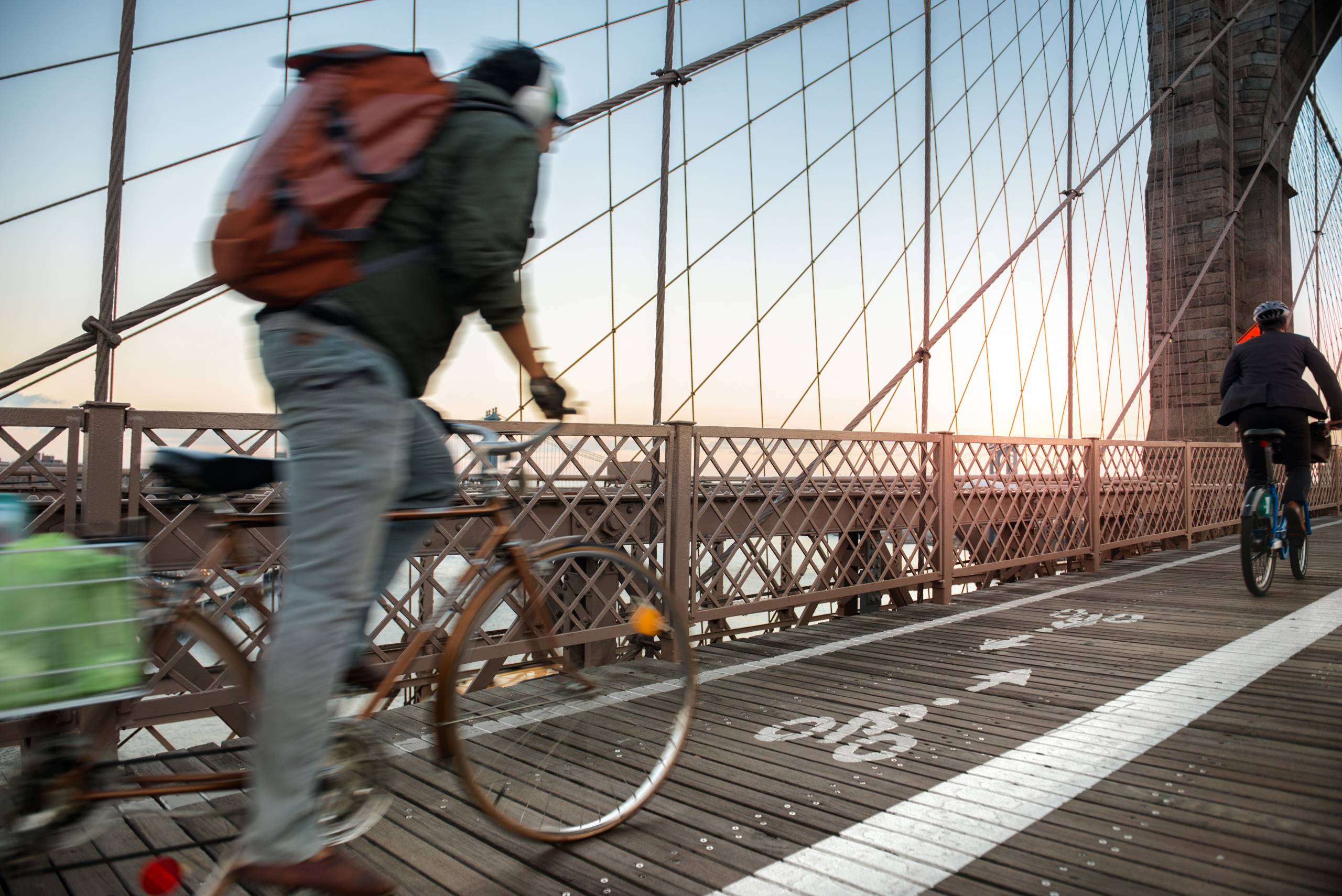 Cyclist in bike lane on Brooklyn Bridge in NY