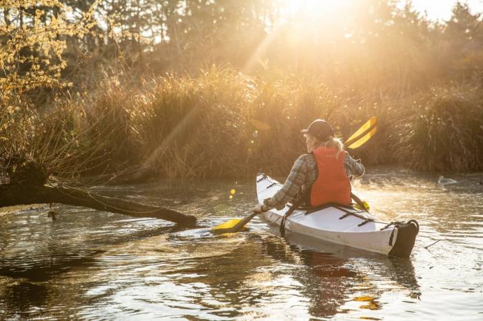 Photographer Mo Heim kayaking at dawn