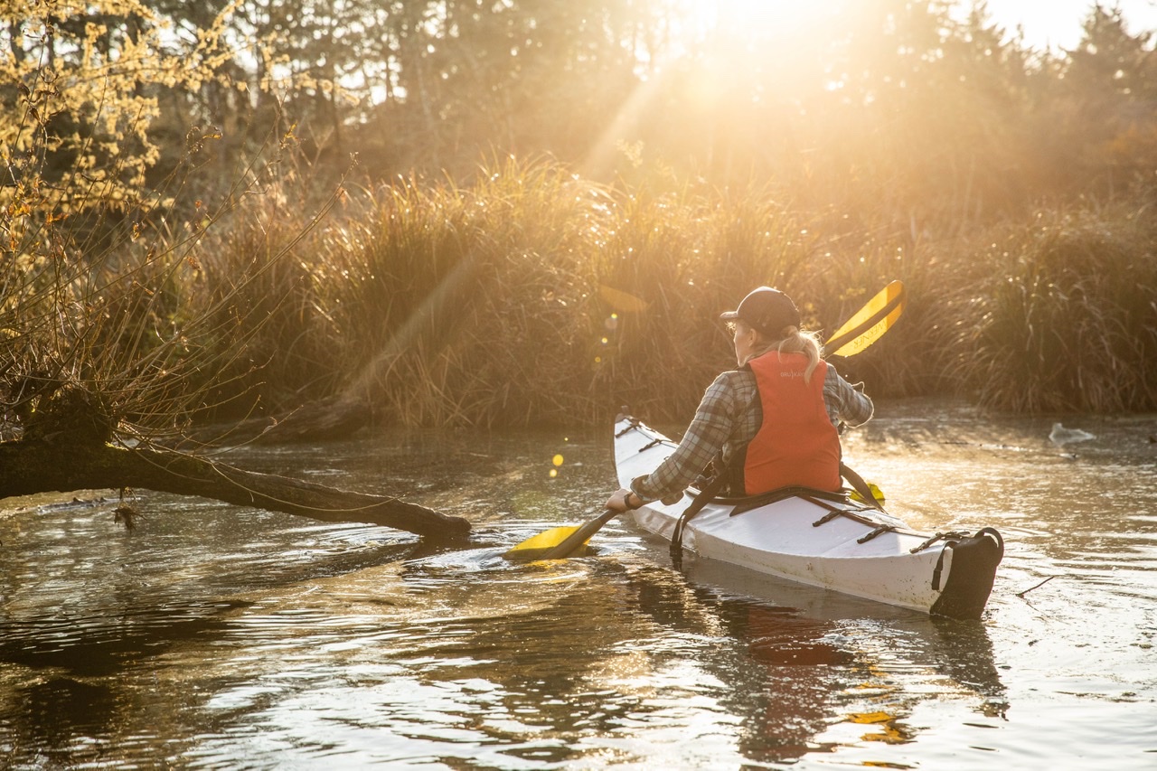Photographer Mo Heim kayaking at dawn
