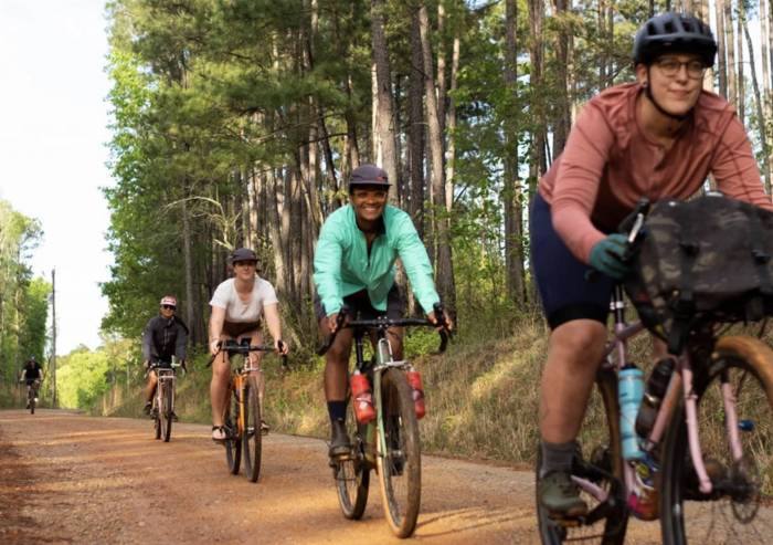 four cyclists on an Atlanta gravel trail in a Kitsbow short film