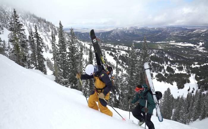 two skiers ascending mount blackmore in montana