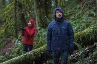 Save on Garmin, Columbia, Smartwool, and More Gear Deals People Hiking in the Forest in Columbia Rain Jackets