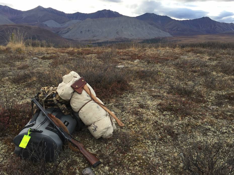 Truck-Offices, Calf Pillows: What a Hunting Guide Carries for Work, Travel Panga field cache with mountains