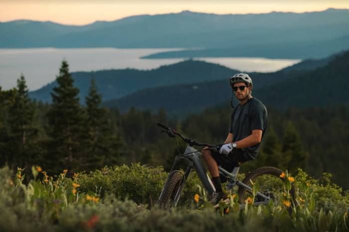 paul basagoitia perched on his Specialized e-mountain bike in an alpine field