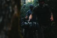 North Carolina Mountain Biking: Ride These Routes in the Blue Ridge two friends with bikes and gear in pigsah national forest in north carolina