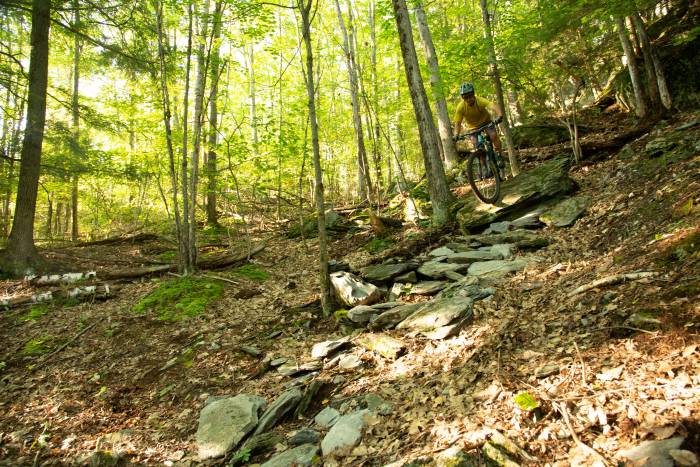 rider going down rocky slope on yeti 160E e-MTB