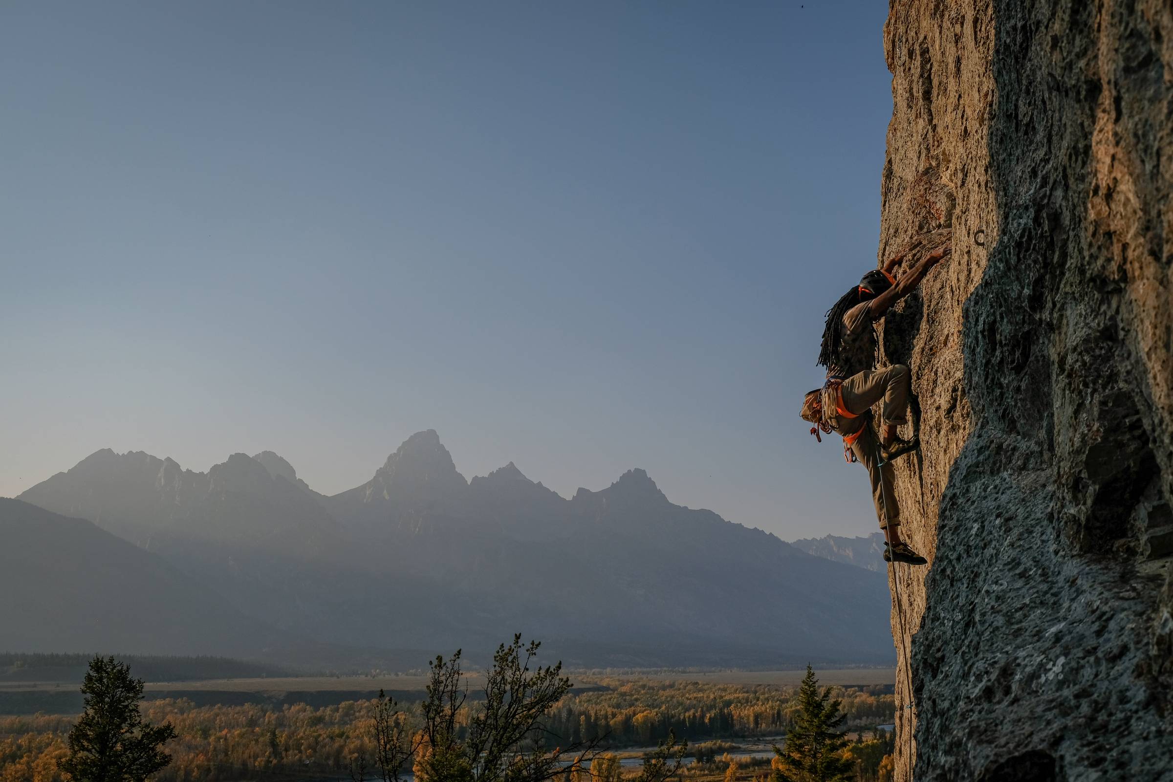 manoah ainuu climbs blacktail butte with grand tetons in the background