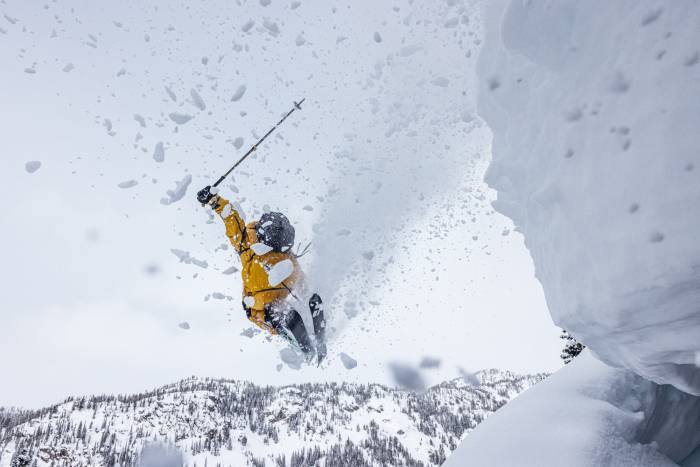 skier hitting edge in burst of powder snow