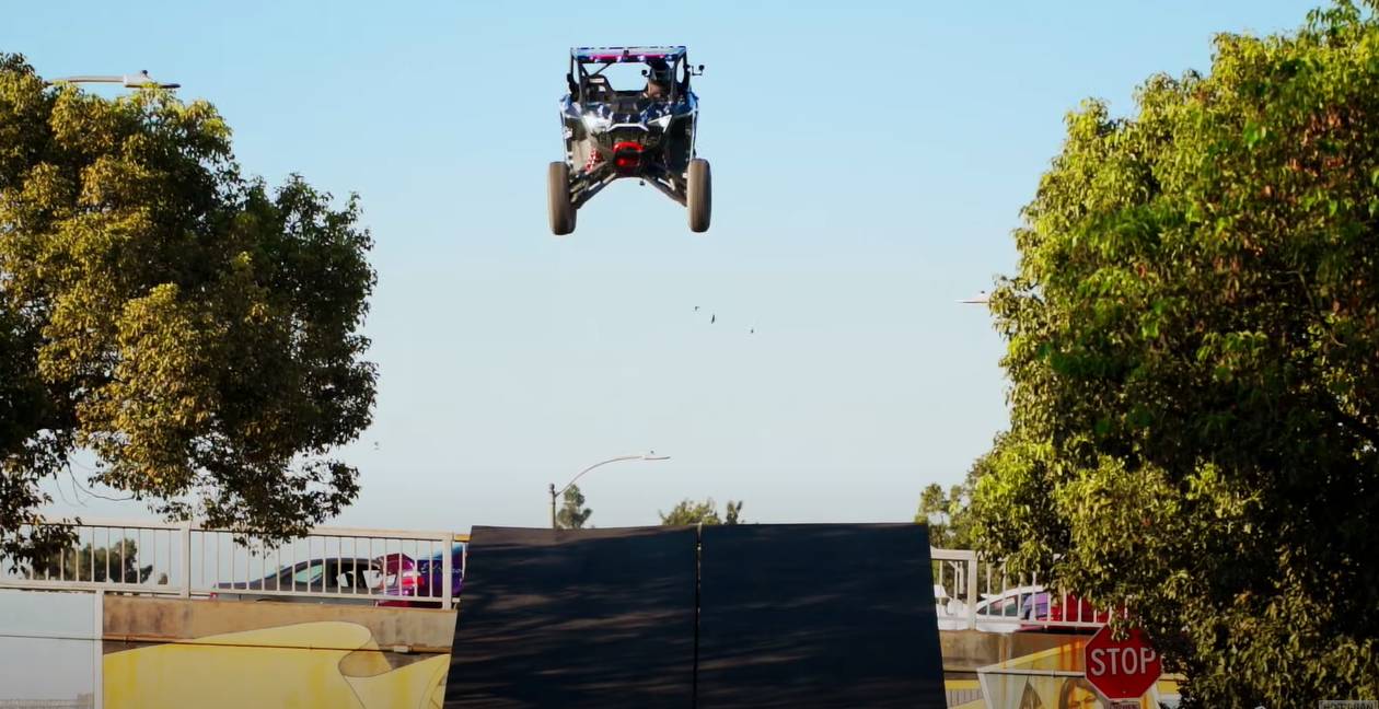 a Polaris RZR Pro R side by side jumping a ramp in california